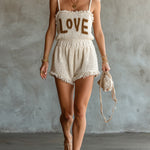 ElevenOra Chic Elegant Cream White Spaghetti-Strap Square-Neck Sleeveless Letter Jacquard Fringe Detail Loose-Fit Knit Romper
