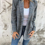 Stella – Timeless Confidence in a Classic Checked Coat