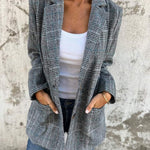 Stella – Timeless Confidence in a Classic Checked Coat