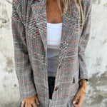 Stella – Timeless Confidence in a Classic Checked Coat