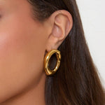 Elegant Curved Gold Open Oval Earrings