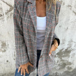 Stella – Timeless Confidence in a Classic Checked Coat